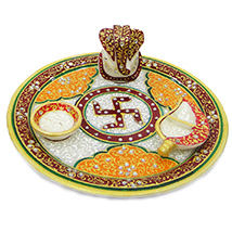 Beautifully decorated marble pooja thali with chopra