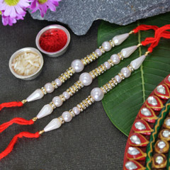 Dazzling Pearl Rakhi set of 3 /></a></div><div class=