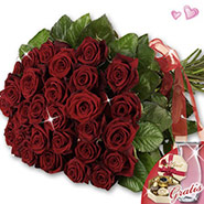 Red roses in vase & Lindt chocolates covenant with